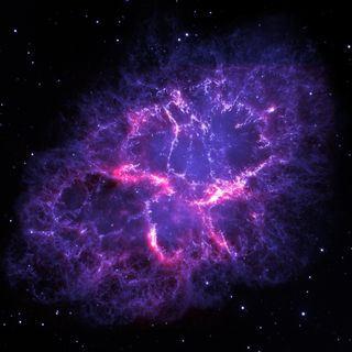 A NASA image of the Crab nebula, imaged by Herschel Space Observatory and the Hubble Space Telescope.